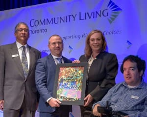 (L-R,) President of the Board, Victor Figueiredo, CEO Brad Saunders, The Honourable Lisa MacLeod, and Self-Advocate Council representative of the Board of Directors, Nelson Raposo.