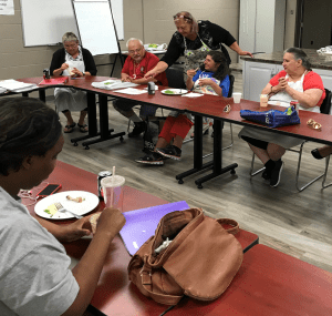 The Healthy cooking class enjoys their well prepared meal.